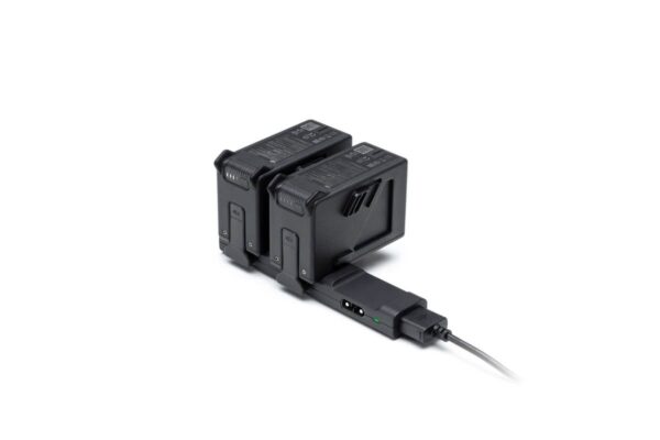 "DJI FPV Battery Charging Hub connected to Intelligent Flight Batteries, showcasing its compact and efficient sequential charging design."